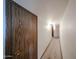 Well-lit hallway with neutral walls and carpet, and featuring a closet for convenient storage solutions at 10401 W Loma Blanca Dr, Sun City, AZ 85351
