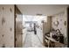 Galley-style kitchen with white appliances and adjacent breakfast nook at 10401 W Loma Blanca Dr, Sun City, AZ 85351