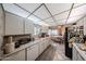 A well-lit kitchen offering ample counter space, updated appliances, and a convenient layout for cooking at 10401 W Loma Blanca Dr, Sun City, AZ 85351