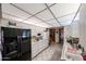Bright kitchen featuring white cabinets, updated appliances, a spacious layout, and tile flooring at 10401 W Loma Blanca Dr, Sun City, AZ 85351