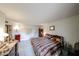 Bright, spacious bedroom featuring neutral walls and carpet, ample closet space, and plenty of natural light at 10401 W Loma Blanca Dr, Sun City, AZ 85351