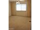 Bedroom with beige carpet, curtains and a ceiling fan at 10428 W Camelot Cir, Sun City, AZ 85351