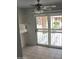 Bright breakfast nook with tile floors and sliding door to the exterior at 10428 W Camelot Cir, Sun City, AZ 85351