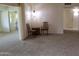 Cozy living area with comfortable seating, neutral carpet and natural lighting at 10428 W Camelot Cir, Sun City, AZ 85351