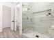 Elegant bathroom with a seamless glass shower, mosaic tile accents, and a modern design at 11662 E Parkview Ln, Scottsdale, AZ 85255