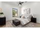 Bright, modern bedroom with natural light, complemented by a ceiling fan and stylish furnishings at 11662 E Parkview Ln, Scottsdale, AZ 85255
