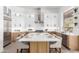 Spacious kitchen with an island and bar seating, stainless steel appliances, and ample counter space at 11662 E Parkview Ln, Scottsdale, AZ 85255