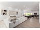Bright and airy living room with a modern sofa, stylish decor, and a seamless connection to the outdoors at 11662 E Parkview Ln, Scottsdale, AZ 85255