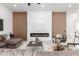 Beautiful living room featuring a sleek fireplace, modern decor, and comfortable seating arrangement at 11662 E Parkview Ln, Scottsdale, AZ 85255