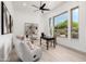 Bright home office with neutral tones, modern light fixture, and large windows with outdoor views at 11662 E Parkview Ln, Scottsdale, AZ 85255