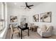 Stylish home office with large windows, ceiling fan, and an open layout to the living room at 11662 E Parkview Ln, Scottsdale, AZ 85255