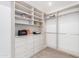 Well-organized walk-in closet featuring built-in shelves, drawers, and ample storage solutions at 11662 E Parkview Ln, Scottsdale, AZ 85255