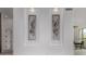 Elegant wall art recessed in a neutral wall with recessed lighting, enhancing the interior with style and sophistication at 11662 E Parkview Ln, Scottsdale, AZ 85255