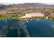 Stunning aerial view of community lake, dock, desert landscape, and mountains in background at 12325 S 179Th S Ave # 0, Goodyear, AZ 85338