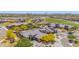 An aerial view shows this beautiful desert home is part of a vibrant community with golf course and lush landscape at 12325 S 179Th S Ave # 0, Goodyear, AZ 85338