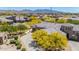 Scenic aerial view of a beautiful home with desert landscape, paver driveway, and golf course views at 12325 S 179Th S Ave # 0, Goodyear, AZ 85338
