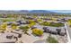 Expansive aerial shot highlighting the home's desert landscape, paver driveway, golf course, and surrounding community at 12325 S 179Th S Ave # 0, Goodyear, AZ 85338