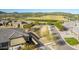 High-angle aerial view overlooking the house, surrounding street, golf course, and adjacent undeveloped land at 12325 S 179Th S Ave # 0, Goodyear, AZ 85338