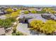 Stunning aerial view of a home with desert landscaping, tile roof, and a paver driveway in a vibrant community at 12325 S 179Th S Ave # 0, Goodyear, AZ 85338