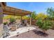 The backyard patio offers dining space under a pergola with lovely desert landscaping at 12325 S 179Th S Ave # 0, Goodyear, AZ 85338