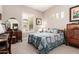 Comfortable bedroom featuring matching vanity, bedspread, and dresser at 12325 S 179Th S Ave # 0, Goodyear, AZ 85338