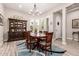 Elegant dining room with stylish chandelier, wooden furniture set, and bay windows at 12325 S 179Th S Ave # 0, Goodyear, AZ 85338