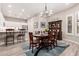 Open concept kitchen and dining area are enhanced with lots of natural light and hardwood floors at 12325 S 179Th S Ave # 0, Goodyear, AZ 85338