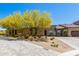 Inviting front exterior with desert landscaping, a patterned paver driveway, and a well-maintained facade under a clear sky at 12325 S 179Th S Ave # 0, Goodyear, AZ 85338