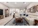 Comfortable living room with a large sectional sofa, decorative rug, and tasteful furnishings at 12325 S 179Th S Ave # 0, Goodyear, AZ 85338