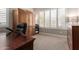 Cozy office with a large desk, built-in cabinets, and natural light at 12325 S 179Th S Ave # 0, Goodyear, AZ 85338