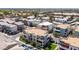 Modern community with a mix of multi-story townhomes, manicured lawns, and street parking at 1250 N Abbey Ln # 275, Chandler, AZ 85226