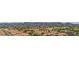 Extensive residential community with red-tiled roofs nestled amongst lush greenery and mountain views at 1250 N Abbey Ln # 275, Chandler, AZ 85226
