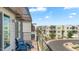Inviting balcony with comfortable seating overlooking a well-maintained neighborhood, ideal for unwinding at 1250 N Abbey Ln # 275, Chandler, AZ 85226