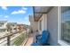Relaxing balcony with blue Adirondack chairs, offering beautiful views of the community and surrounding area at 1250 N Abbey Ln # 275, Chandler, AZ 85226