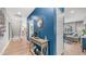 Stylish entryway with elegant decor, a mirror, and a glimpse into the adjacent living spaces at 1250 N Abbey Ln # 275, Chandler, AZ 85226