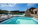 Community pool with an inviting in-ground spa and ample seating around the pool deck for relaxation and socializing at 1250 N Abbey Ln # 275, Chandler, AZ 85226