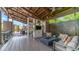 Inviting covered patio featuring a fire pit, comfortable seating, and an outdoor dining area at 1250 N Abbey Ln # 275, Chandler, AZ 85226