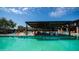 Community pool area featuring a shaded pavilion and plenty of lounge chairs to bask in the sun at 1250 N Abbey Ln # 275, Chandler, AZ 85226