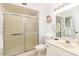 Bright bathroom features a shower and vanity with marble countertop at 12739 W Prospect Dr, Sun City West, AZ 85375