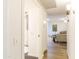 Inviting hallway featuring modern lighting, neutral paint, and durable floors leading to a warm and welcoming living space at 12739 W Prospect Dr, Sun City West, AZ 85375