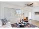 Bright sitting room with a soft couch and lots of natural light at 12739 W Prospect Dr, Sun City West, AZ 85375