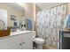 Bathroom featuring a white vanity, and a shower with patterned curtain at 13418 N 108Th Dr, Sun City, AZ 85351