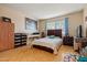 Comfortable bedroom with a large window, ample storage, and neutral decor at 13418 N 108Th Dr, Sun City, AZ 85351