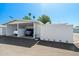 View of a carport with two cars parked, showcasing the property's parking solution at 13418 N 108Th Dr, Sun City, AZ 85351