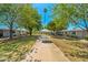 Charming courtyard with manicured lawns and walking paths between residential buildings at 13418 N 108Th Dr, Sun City, AZ 85351