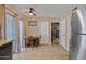 Bright dining area features a ceiling fan, and sliding glass door at 13418 N 108Th Dr, Sun City, AZ 85351