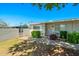 Well-kept home exterior with green landscaping, a brick privacy wall, and a welcoming entrance at 13418 N 108Th Dr, Sun City, AZ 85351