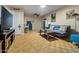 Cozy living room features comfortable seating, and wood floors at 13418 N 108Th Dr, Sun City, AZ 85351