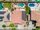 Overhead image featuring a backyard oasis with pool, desert landscaping, and a home equipped with solar panels at 13965 N 135Th Dr, Surprise, AZ 85379