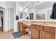Bathroom with dual sinks, storage, shower and lighting at 13965 N 135Th Dr, Surprise, AZ 85379